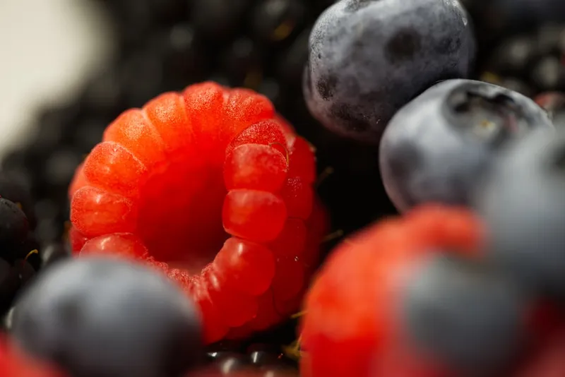 Close up of raspberries and blueberries